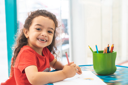 Photo of a young person coloring 